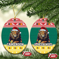 Two green ceramic round Christmas ornaments with lion in Santa hat and gold hanging loops.