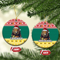 Green ceramic Christmas ornament with lion in Santa hat, round design and gold hanging loop.
