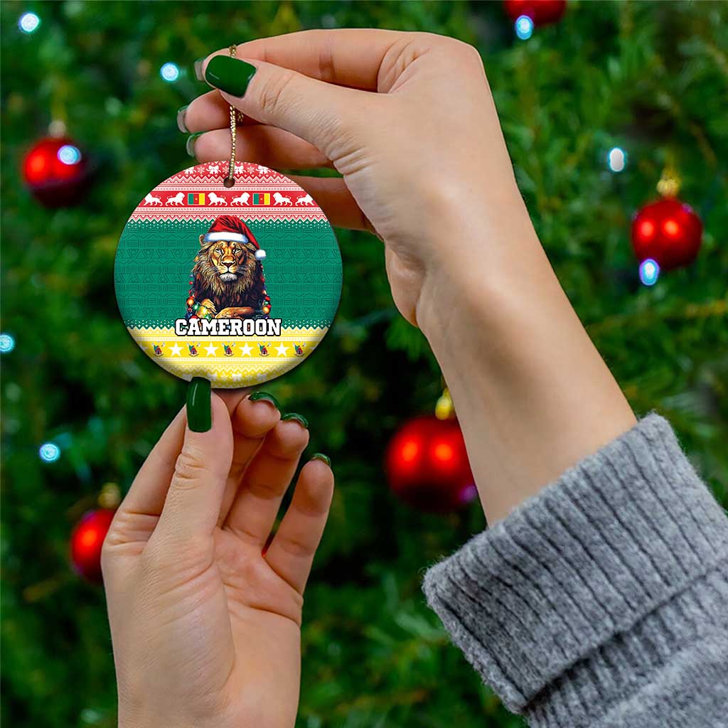 Hand-held green ceramic Christmas ornament showing lion in Santa hat on a round medallion.