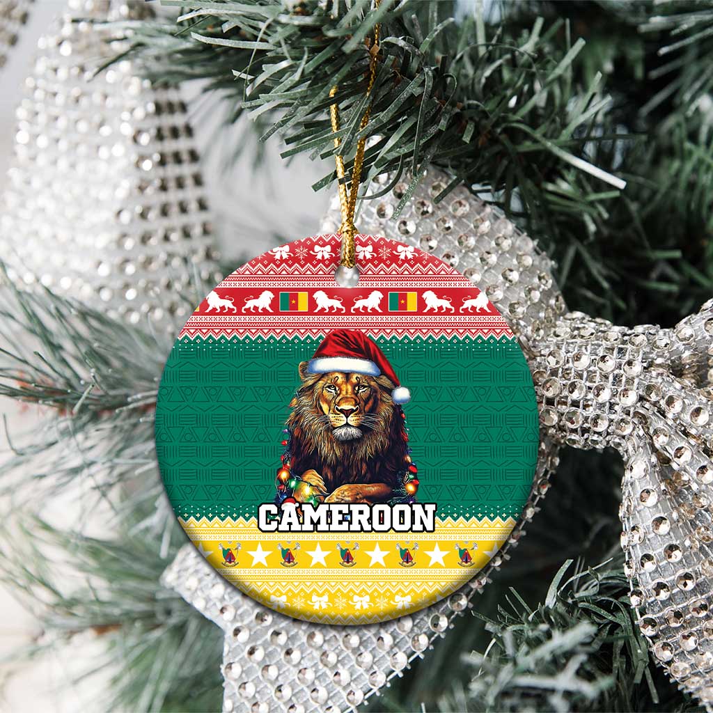 Green ceramic round Christmas ornament with lion in Santa hat and gold hanging loop on tree.