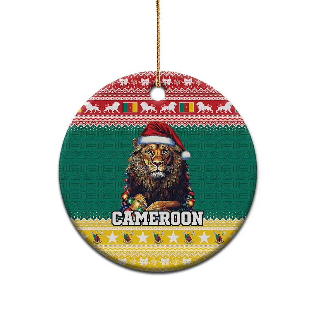 Green ceramic round Christmas ornament with lion in Santa hat, gold hanging loop at top.