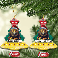 Pair of green ceramic bell-shaped Christmas ornaments with lion in Santa hat and gold loops.