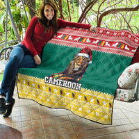 Green Christmas quilt held on a couch with lion wearing Santa hat and CAMEROON text