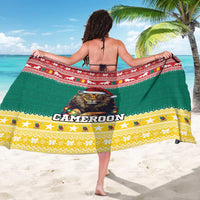 Green Cameroon sarong with lion face graphic, stars, and yellow patterned hem border