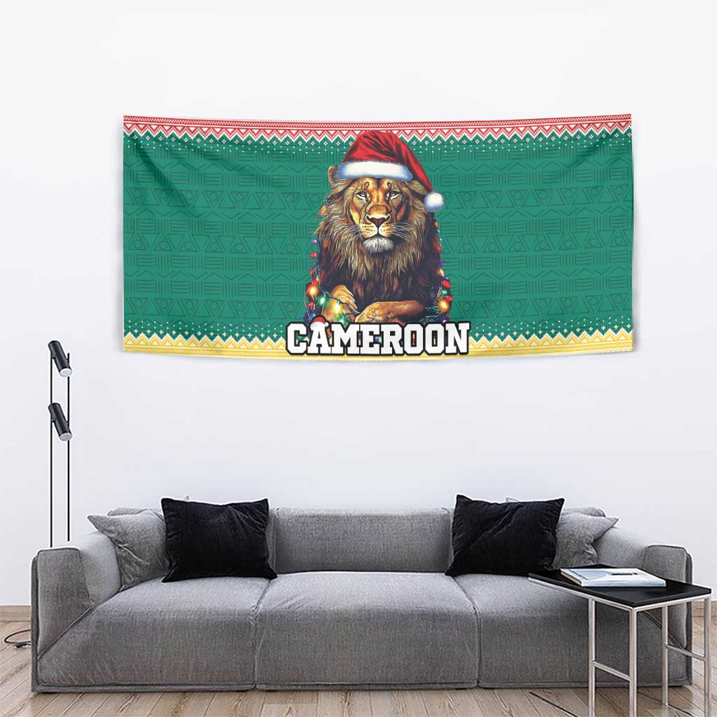 Green Christmas tapestry showing lion with Santa hat, glowing lights, Cameroon title