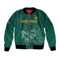 Green bomber jacket with front zipper, ribbed cuffs, and South Africa cricket graphic