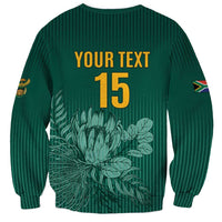 Green unisex cricket sweatshirt with back YOUR TEXT 15 and Proteas floral graphic