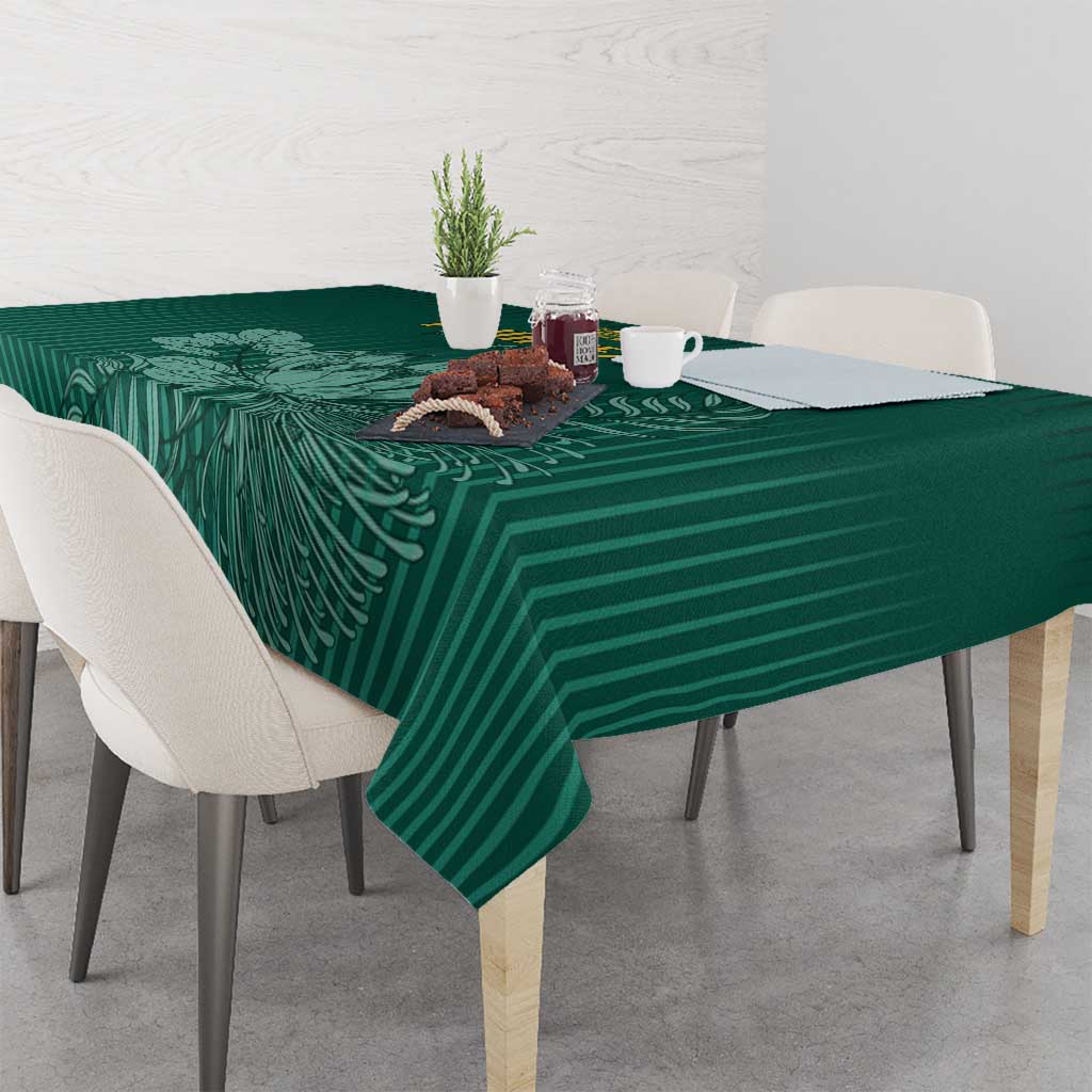 Green cricket tablecloth with striped leaf motif, draped over table corner