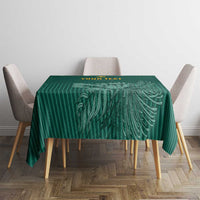 Green cricket tablecloth on small table with leaf and striped decorative pattern