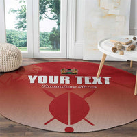 Red round football carpet on wooden floor with "YOUR TEXT" and Harambe Stars logo