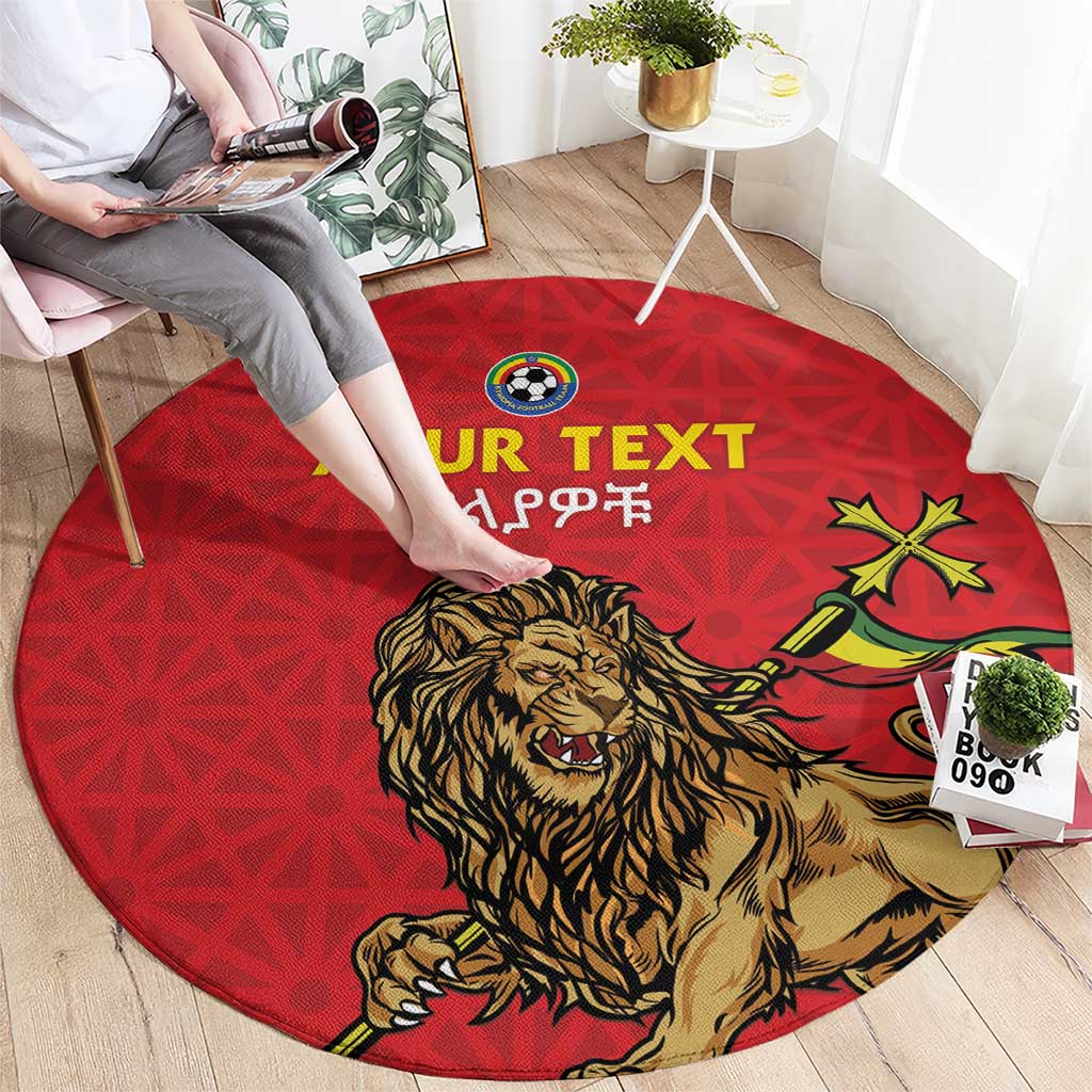 Red round rug with lion mascot, star accents, and 'YOUR TEXT' lettering