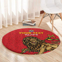 Red round carpet rug with lion graphic, star accents, and 'YOUR TEXT' text