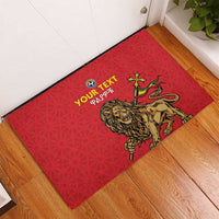 Red rubber doormat with roaring lion graphic, soccer ball, and 'YOUR TEXT' text