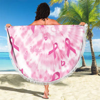 Pink tie-dye round beach blanket with breast cancer ribbon motifs and fringe trim