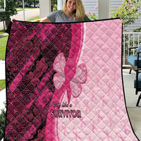Pink and dark maroon quilt with quilted diamonds, ribbon-butterfly graphic, and “Survivor” text