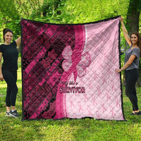 Breast cancer awareness quilt in pink and maroon with quilted diamonds and “Survivor” print