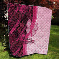 Pink and dark maroon quilt with diagonal patterned panels, quilt stitching, and “Survivor” graphic
