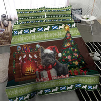 Christmas bedding set showing green stripe and dog-silhouette trim with terrier and fireplace