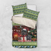 Christmas bedding set flat lay: terrier duvet and matching green striped pillowcases