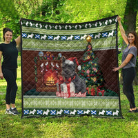 Christmas quilt featuring a Scottish terrier on green tartan background with festive border