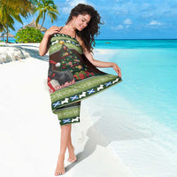 Christmas sarong worn as a wrap skirt, terrier and festive lights scene with green border
