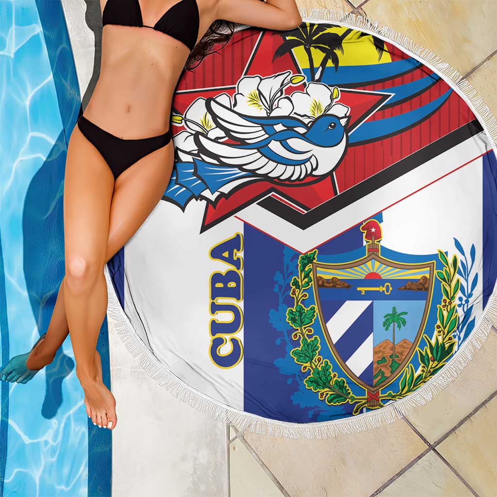Round beach blanket close-up with fringe, Cuba crest and blue bird on blue red white