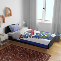Cuba-themed bedding set on bed: blue, white, and red duvet with bird artwork and matching pillows