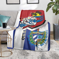 Cuba print blanket on floor with red, blue, white stripes and bird mascot graphic