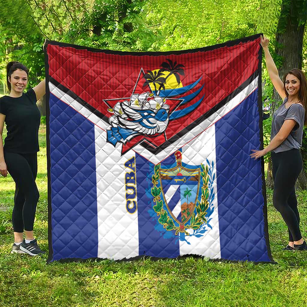 Cuba-themed quilt spread outdoors with red top, blue sides, white center, and crest graphic
