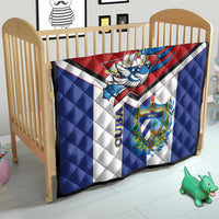 Cuba-themed quilt on a crib, red top, blue sides, white center, bird emblem and crest