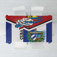 Cuban-themed tablecloth with blue crest and bird graphic, red and white border, top view
