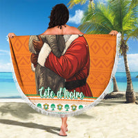 Orange round beach blanket with Santa, elephant graphic, and white fringe trim