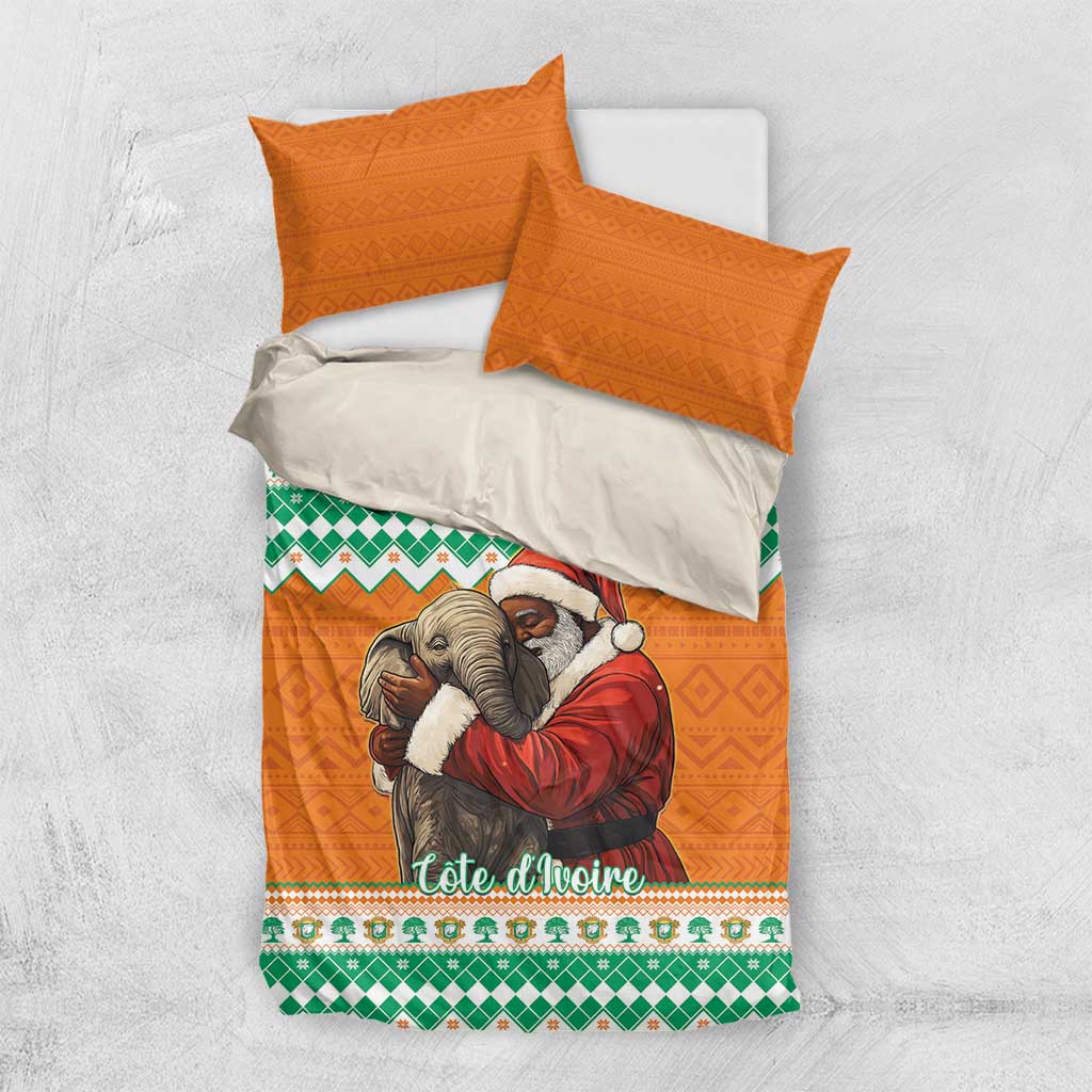 Christmas bedding set top view: orange duvet with elephant and Santa hug, green patterned band