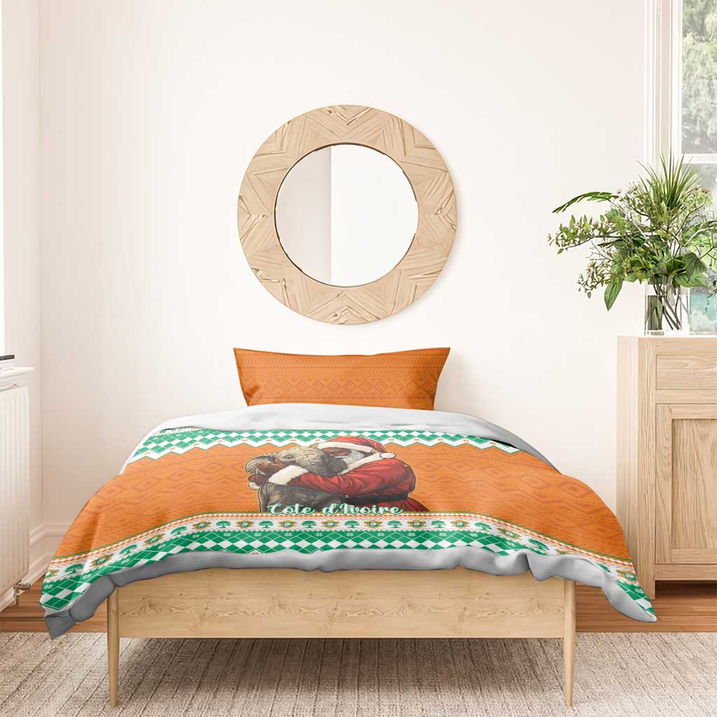 Christmas bedding set with orange duvet showing elephant hugging Santa, green patterned border