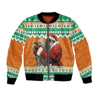 Bomber jacket with orange sleeves, green trim, Santa and elephant graphic, zip front
