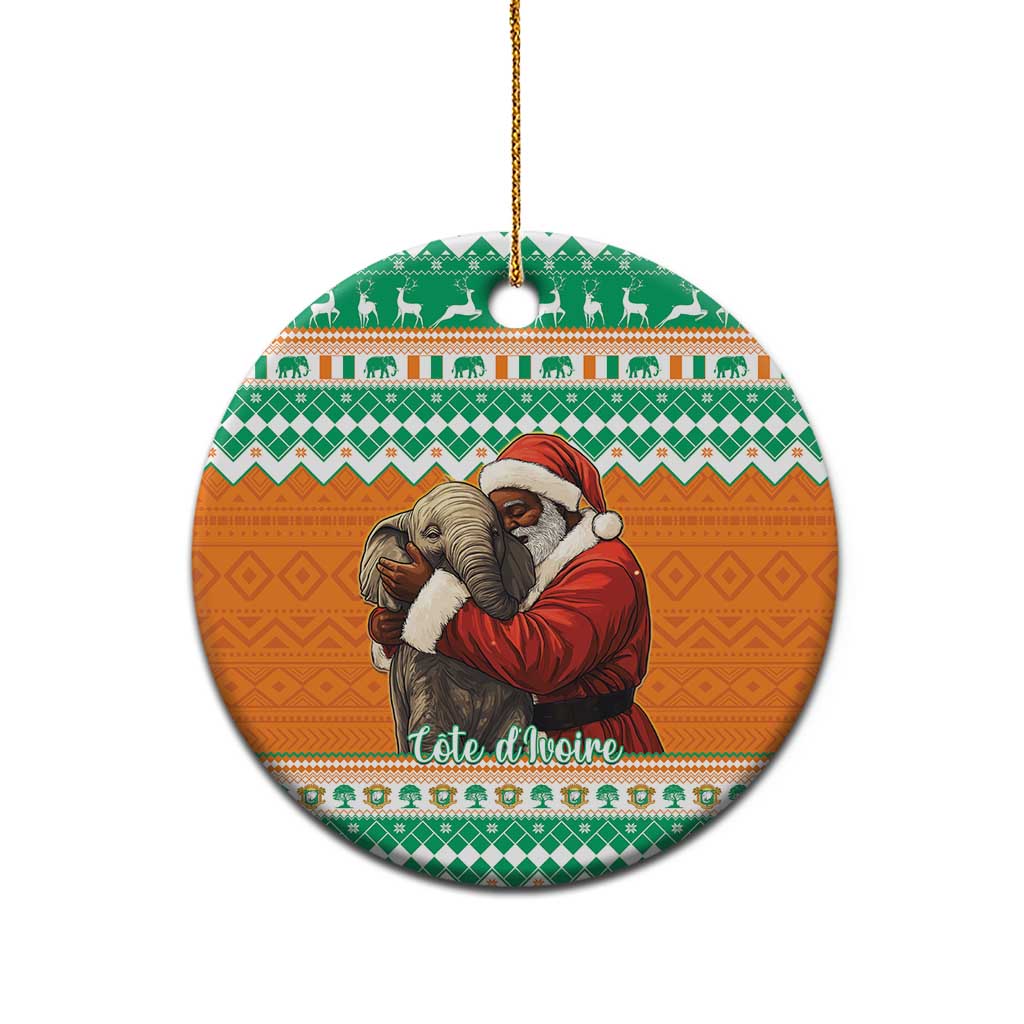 Round ceramic Christmas ornament with gold loop, orange and green Santa hugging elephant
