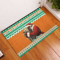 Orange rubber doormat with Santa hugging elephant, zigzag green and orange trim