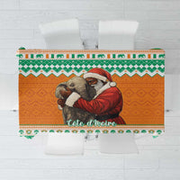 Christmas tablecloth featuring a hugging elephant with Santa in green and orange