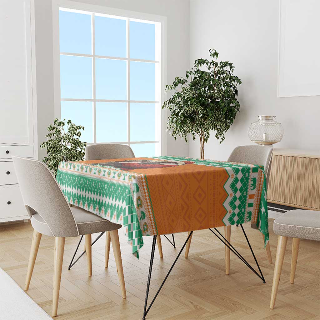 Festive tablecloth with green and orange geometric pattern and multicolor border