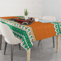 Festive tablecloth with green geometric pattern and orange center panel