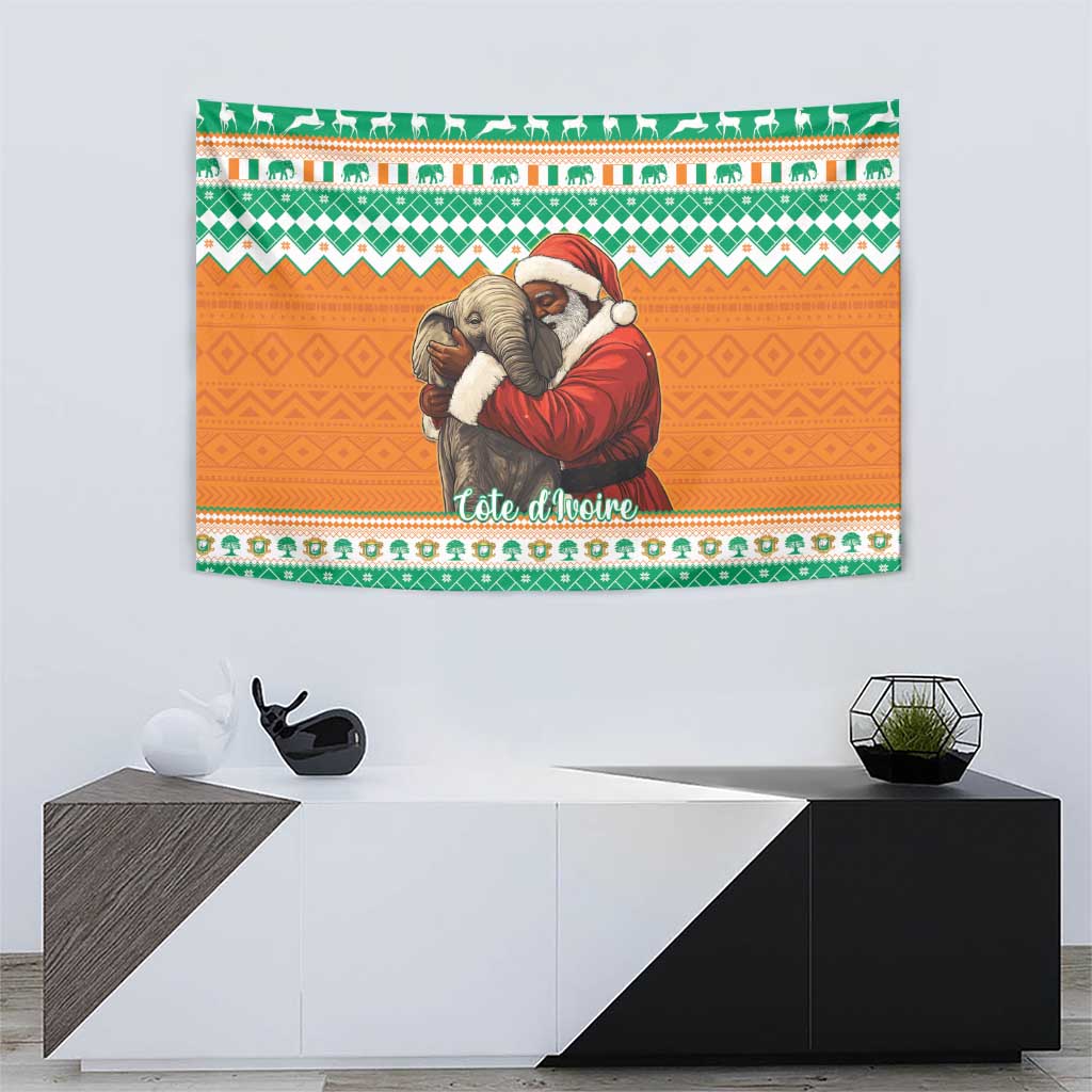 Christmas wall tapestry showing Santa hugging elephants, green geometric border on orange background.