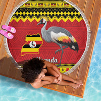 Round Uganda beach blanket partially covering a person, crowned crane and flag map print, fringed