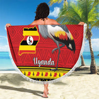 Round Uganda beach blanket held up by a person, crowned crane and flag map print, fringed
