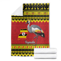 Folded crowned crane throw blanket with Uganda flag map, red yellow black design