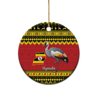 Round Christmas ceramic ornament with grey crowned crane, red Uganda flag/map pattern.