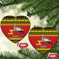 Christmas ceramic ornament in heart shape, red Uganda design with grey crowned crane.