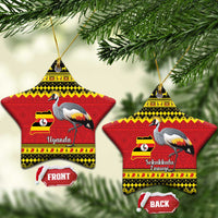 Star-shaped Christmas ceramic ornament with grey crowned crane and Uganda flag/map design.