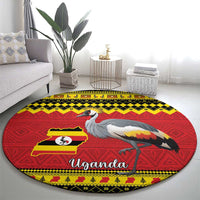 Round red carpet with crowned crane illustration and Uganda text, yellow patterned border