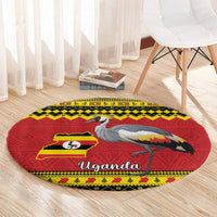 Round crowned crane carpet with Uganda text, red base and yellow geometric border