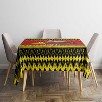 Uganda Christmas tablecloth on square dining table, crowned crane motif in red yellow black